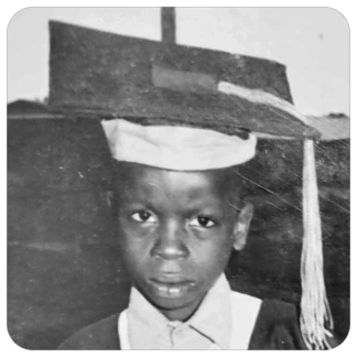Jerry in a graduation cap
